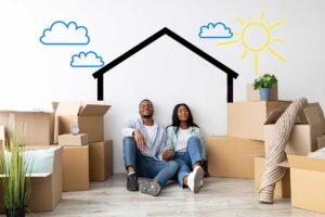 People label moving boxes beside a calendar, packing supplies, and a neatly organized living room.
